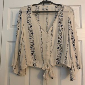 Cream and blue v-neck blouse